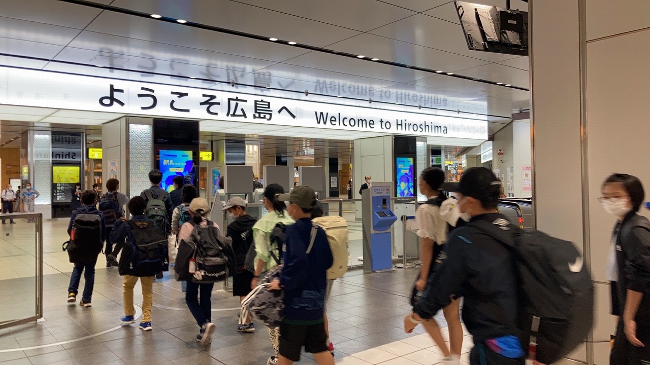 広島着